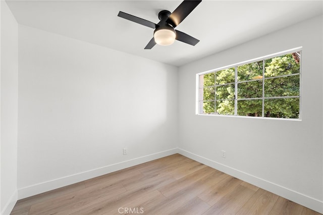 spare room featuring ceiling fan and light hardwood / wood-style floors