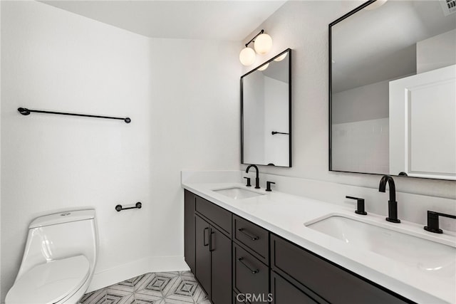 bathroom with toilet and vanity