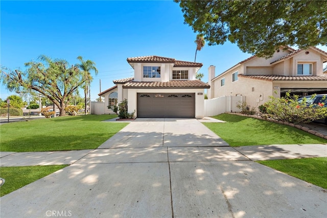 mediterranean / spanish-style house featuring a front lawn and a garage