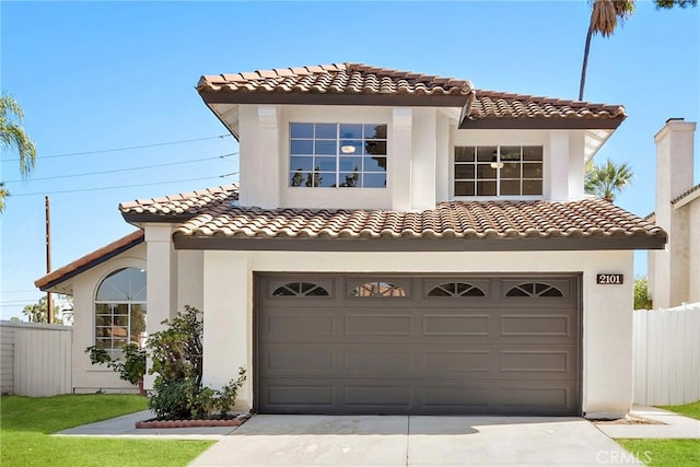 mediterranean / spanish house featuring a garage