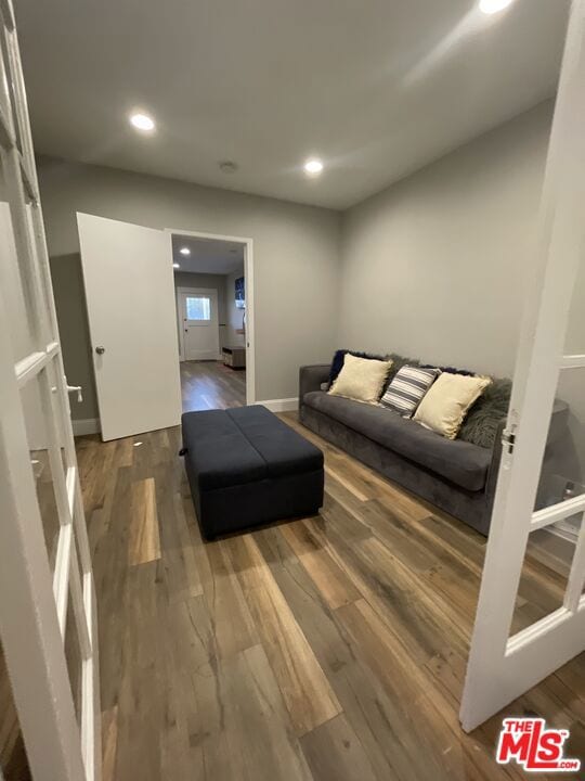 living room featuring dark hardwood / wood-style flooring