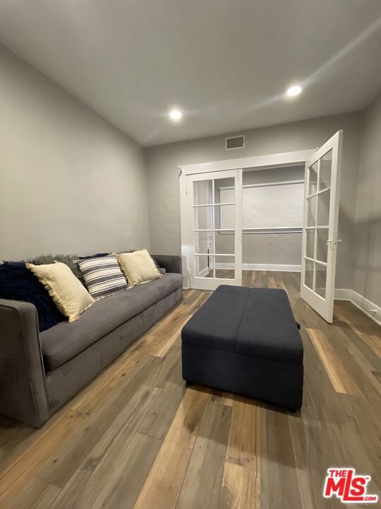 living room featuring french doors and wood-type flooring