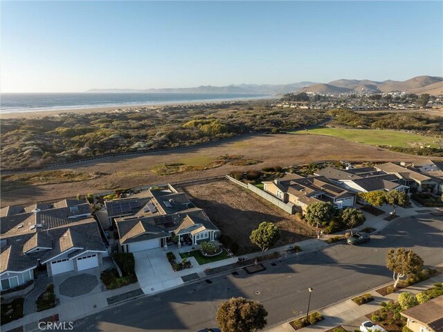 aerial view featuring a water and mountain view