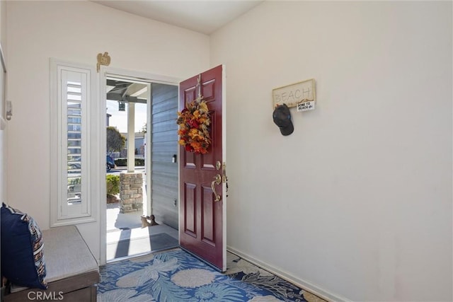 view of carpeted entrance foyer