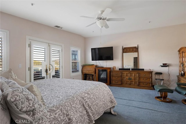 bedroom featuring carpet, ceiling fan, and access to exterior