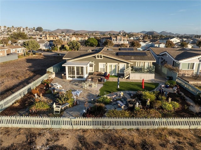 back of property with a mountain view