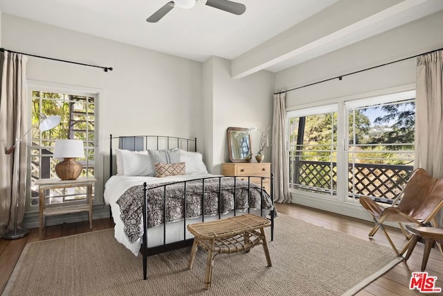 bedroom featuring beamed ceiling, access to outside, hardwood / wood-style flooring, and ceiling fan