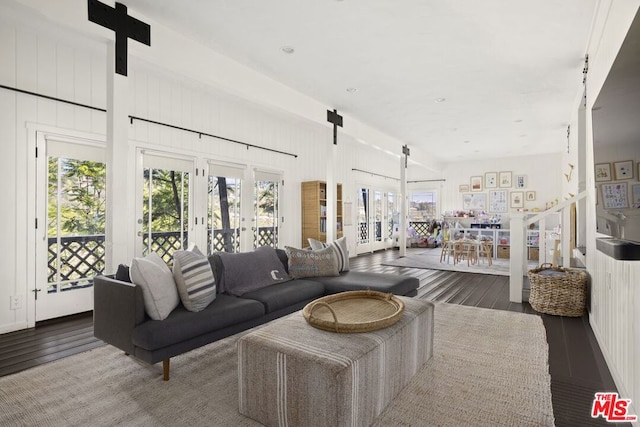 living room featuring french doors and hardwood / wood-style flooring