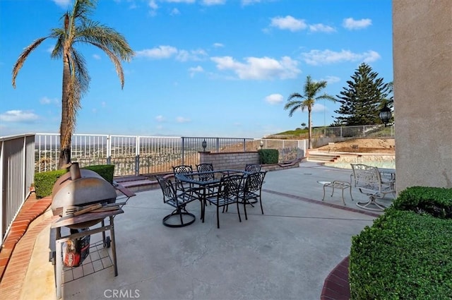 view of patio featuring a grill