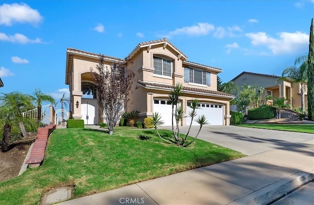 mediterranean / spanish house featuring a garage and a front lawn