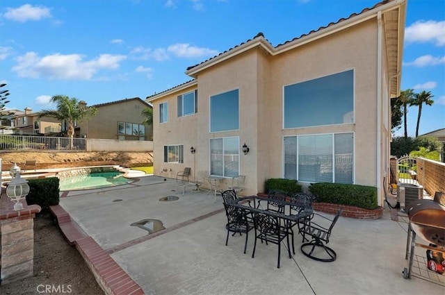 exterior space with a fenced in pool