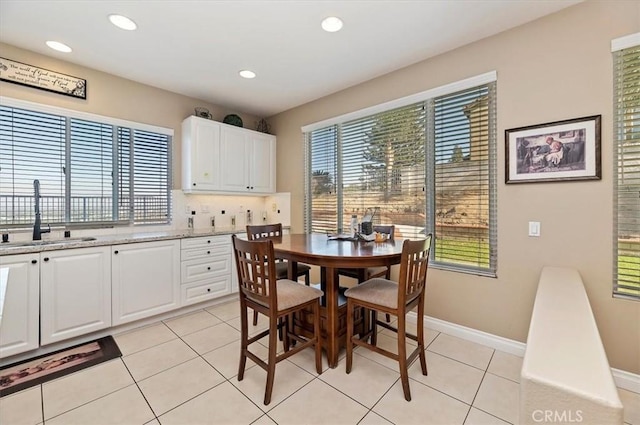 tiled dining area with sink