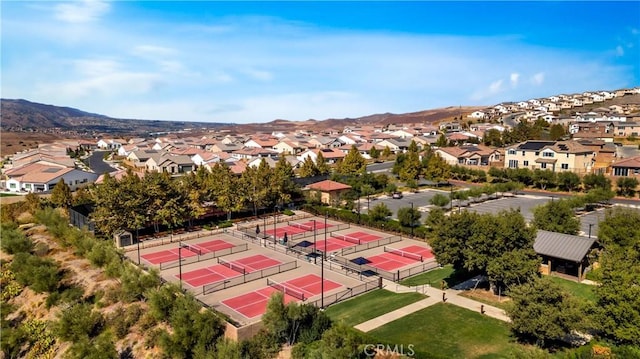 birds eye view of property featuring a mountain view