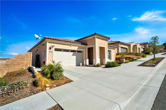 mediterranean / spanish-style home featuring a garage