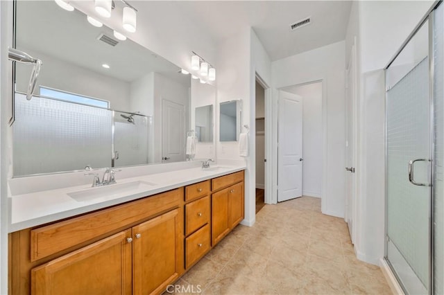 bathroom with vanity and walk in shower