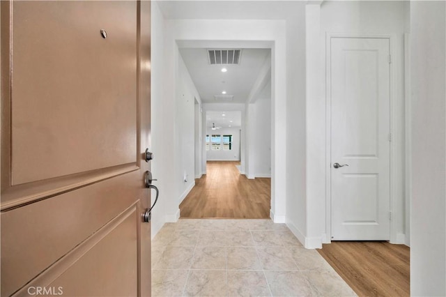 hallway with light wood-type flooring