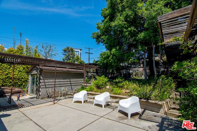 view of patio featuring a pergola