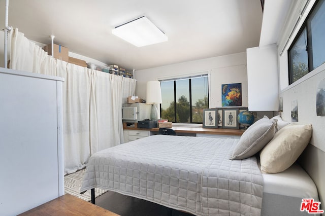 bedroom featuring hardwood / wood-style floors