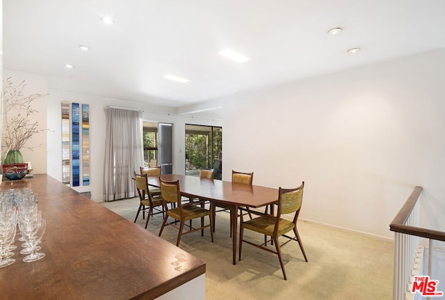 view of carpeted dining area