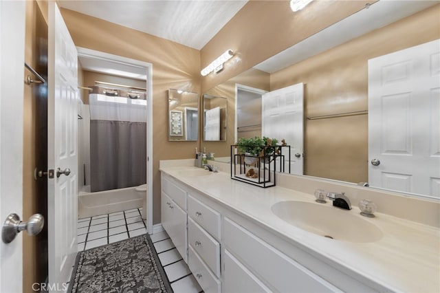 full bathroom with tile patterned floors, vanity, toilet, and shower / bath combo with shower curtain