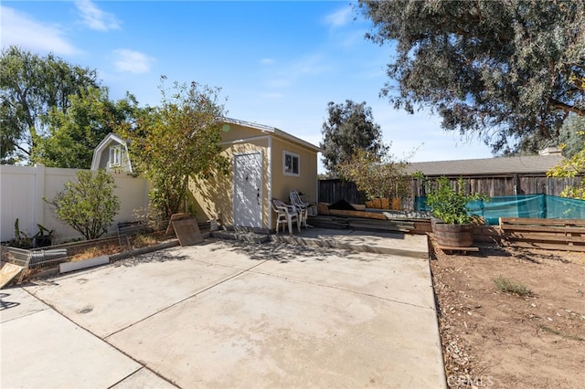 view of patio / terrace featuring a storage shed