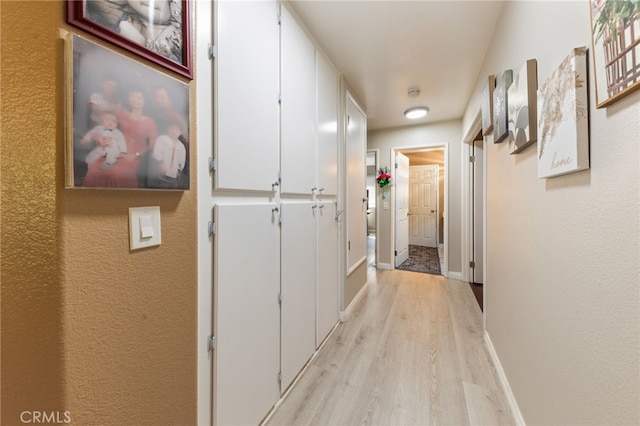 hallway featuring light hardwood / wood-style flooring