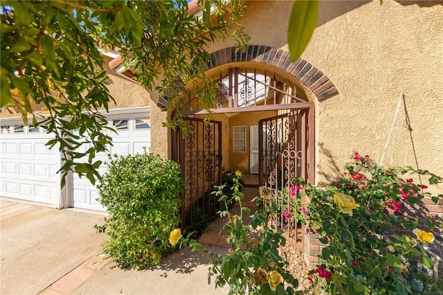 doorway to property featuring a garage