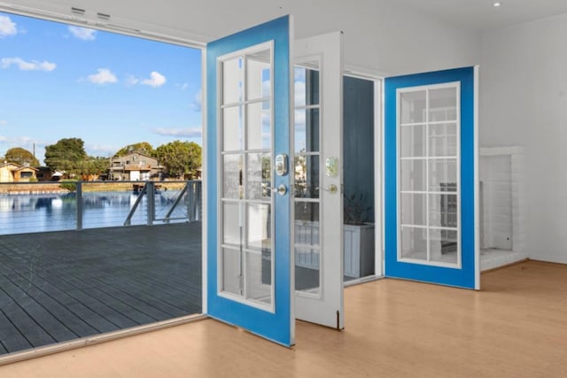 entryway with hardwood / wood-style flooring and french doors