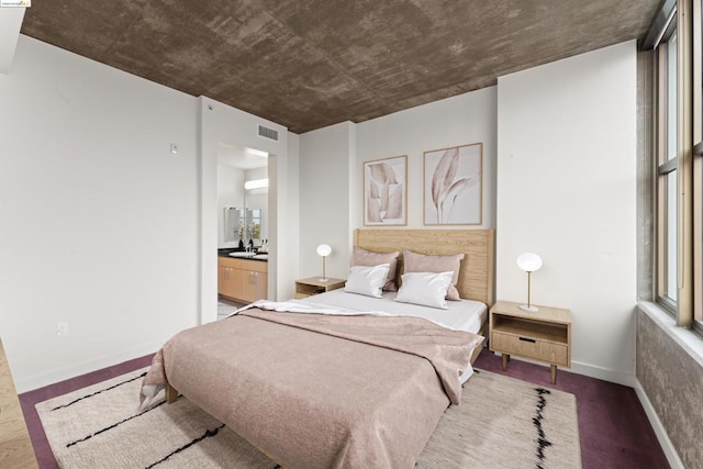 bedroom featuring sink and dark wood-type flooring