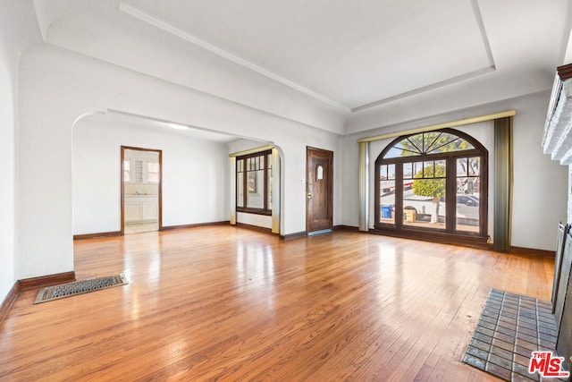 empty room with hardwood / wood-style floors