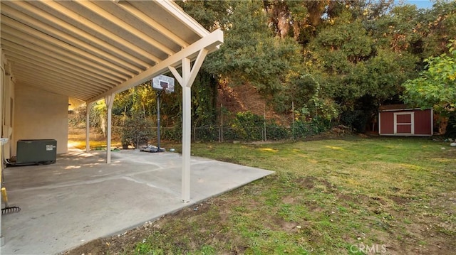 view of yard featuring a patio area and a shed