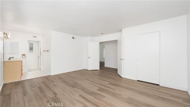 unfurnished bedroom featuring light hardwood / wood-style flooring