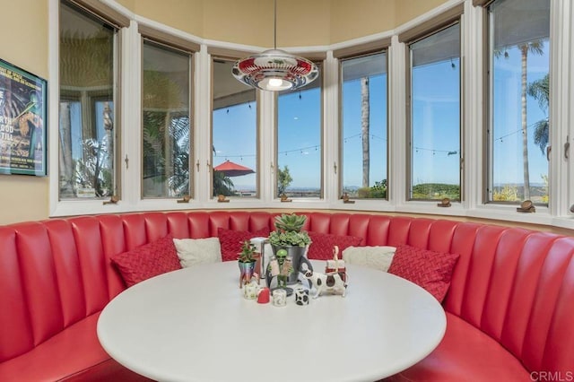 sunroom featuring breakfast area