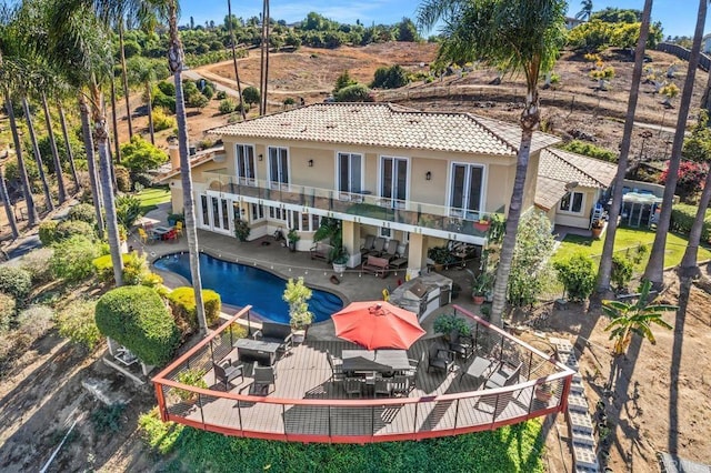 rear view of house featuring a patio