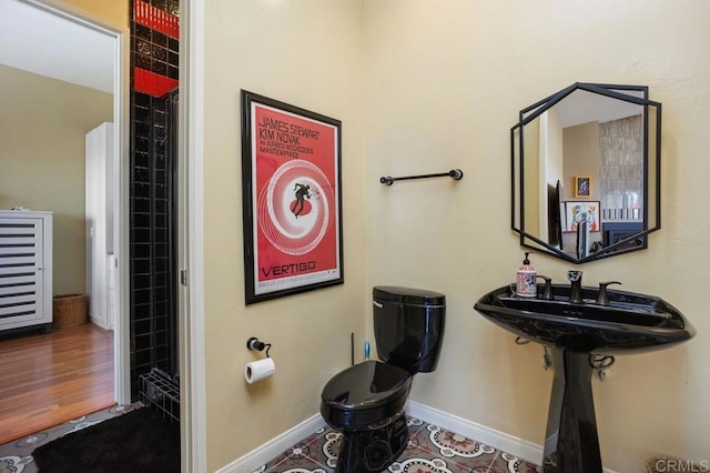 bathroom with sink and hardwood / wood-style flooring