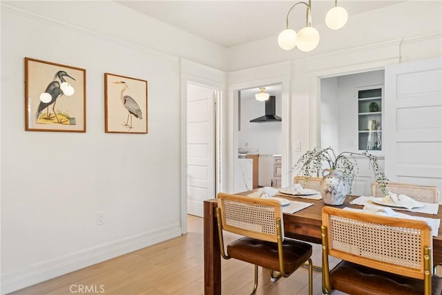 dining space with wood-type flooring