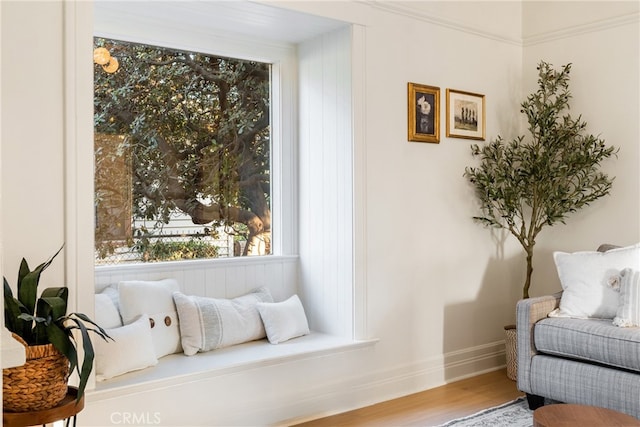 living area with hardwood / wood-style floors