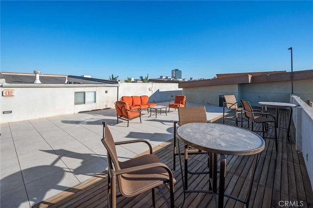 wooden deck featuring outdoor lounge area