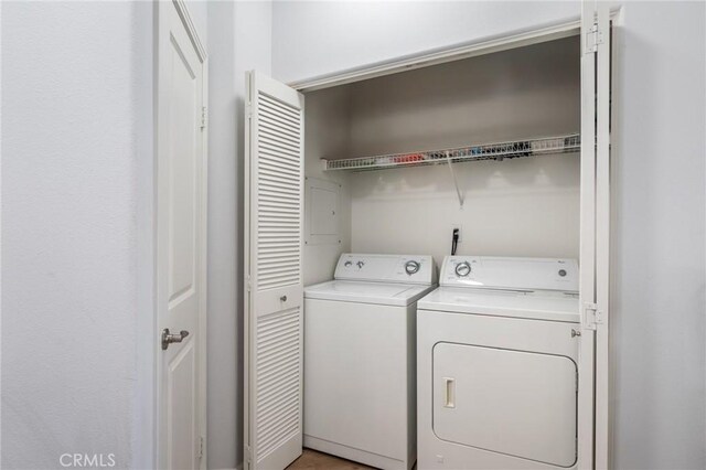 clothes washing area featuring washing machine and dryer