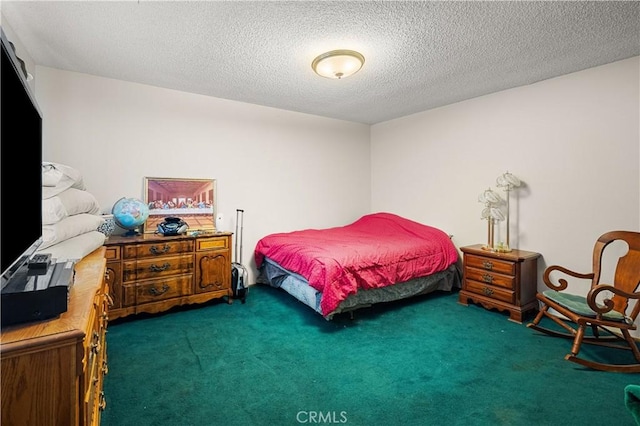 carpeted bedroom featuring a textured ceiling