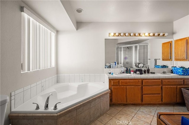 bathroom with vanity, tile patterned floors, and independent shower and bath