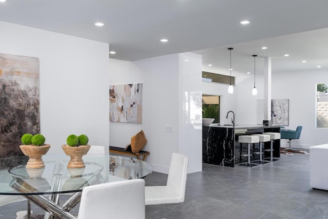 dining space featuring sink