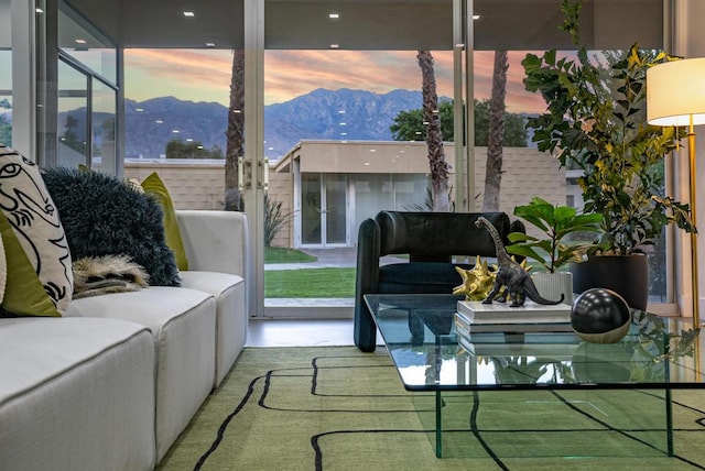 interior space with a mountain view and french doors