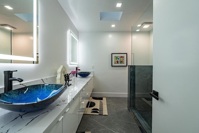 bathroom with vanity and a skylight