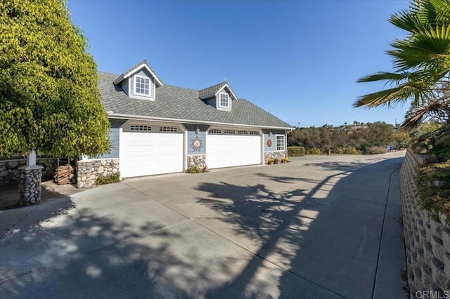 view of side of property featuring a garage