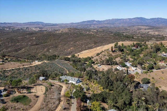 drone / aerial view featuring a mountain view