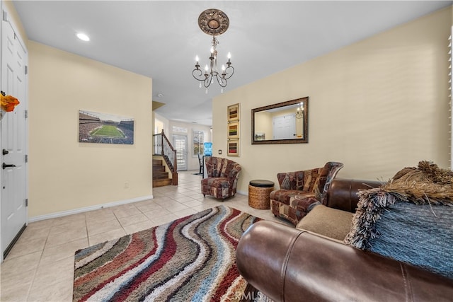 living room featuring a chandelier and light tile patterned flooring