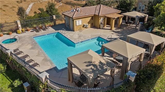 view of swimming pool featuring a patio area