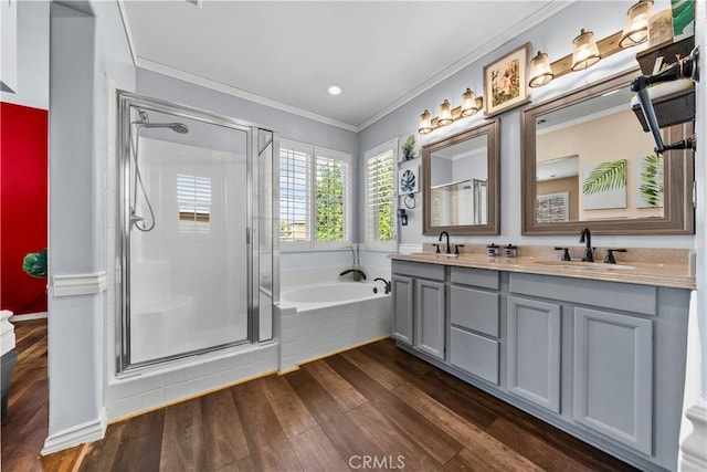 bathroom with independent shower and bath, crown molding, and hardwood / wood-style flooring