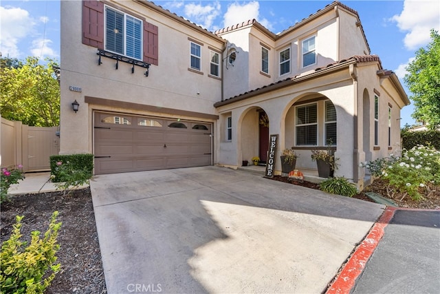 mediterranean / spanish-style house featuring a garage